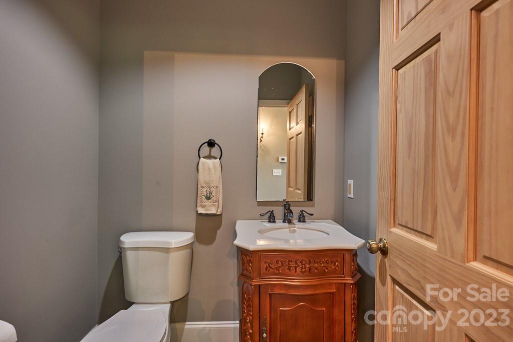 290 Stable Gate Drive Campobello, SC 29322 - Photo 34 of 39 a bathroom with a toilet sink and mirror