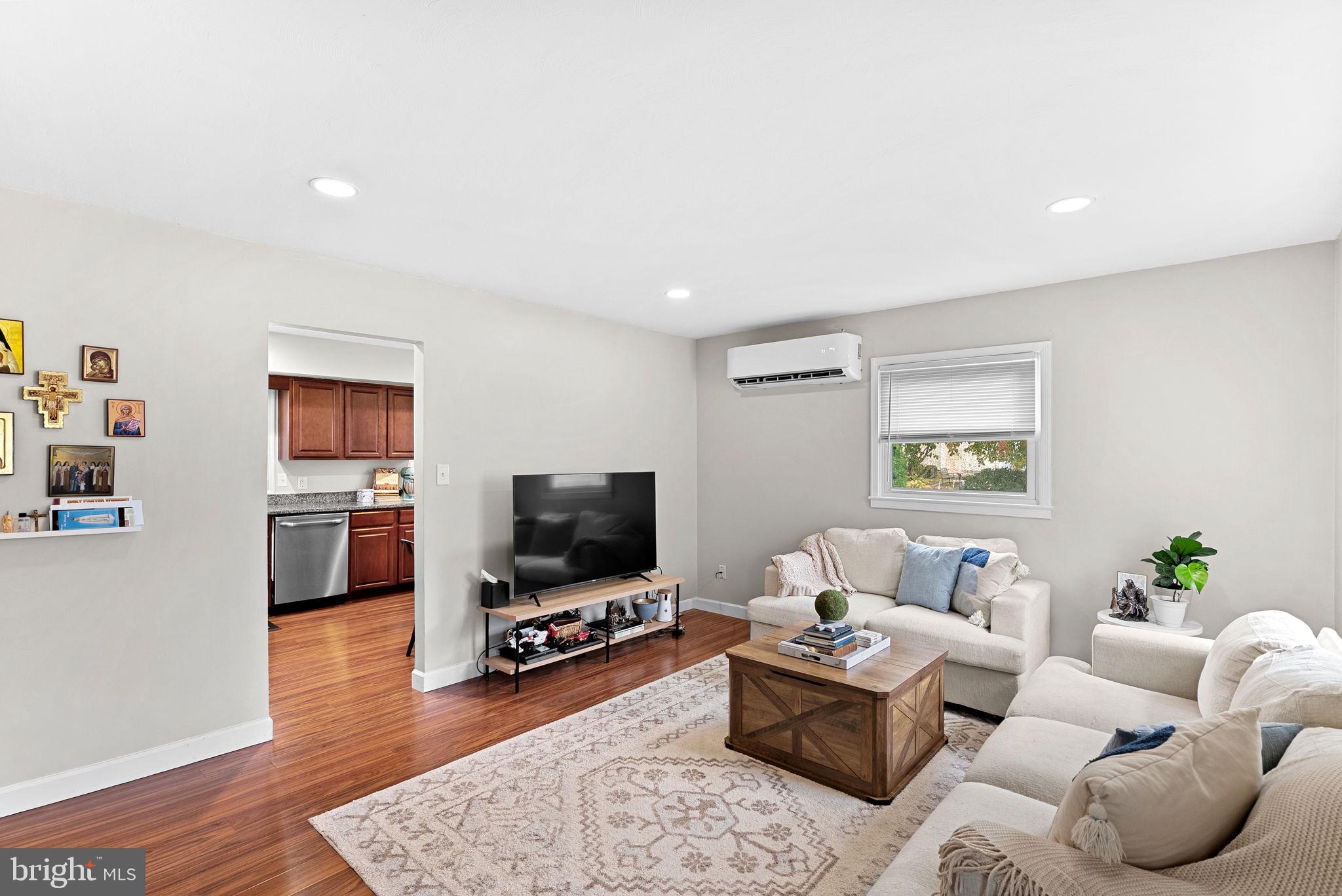 219 Josephine Street Berryville, VA 22611 - Photo 5 of 26 a living room with furniture and a flat screen tv