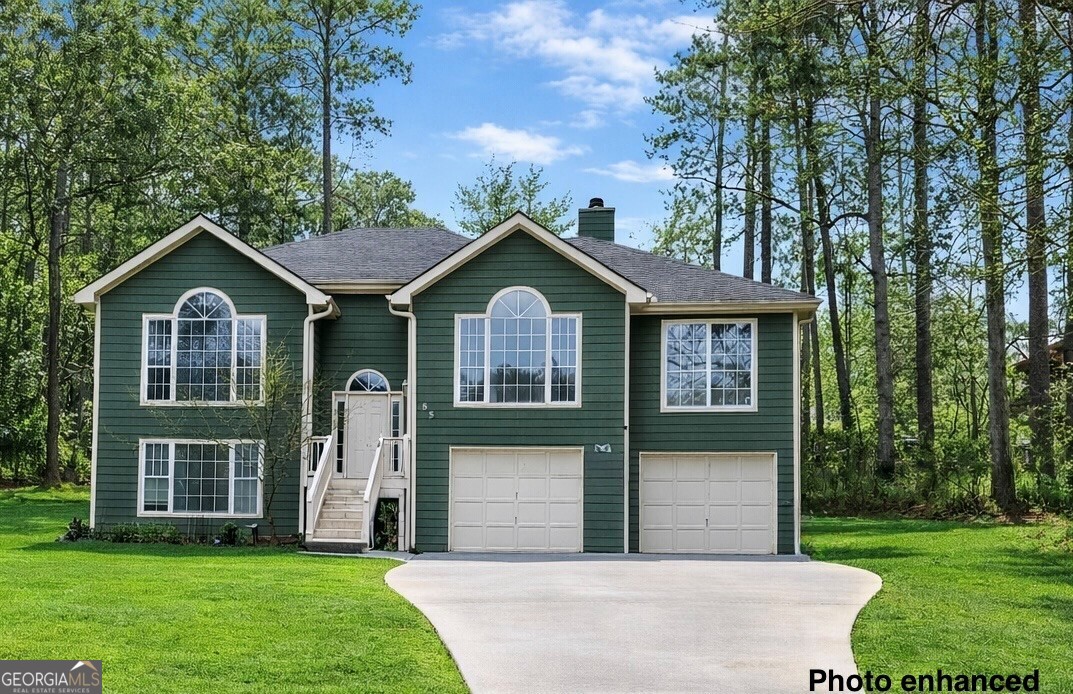 a front view of a house with a garden