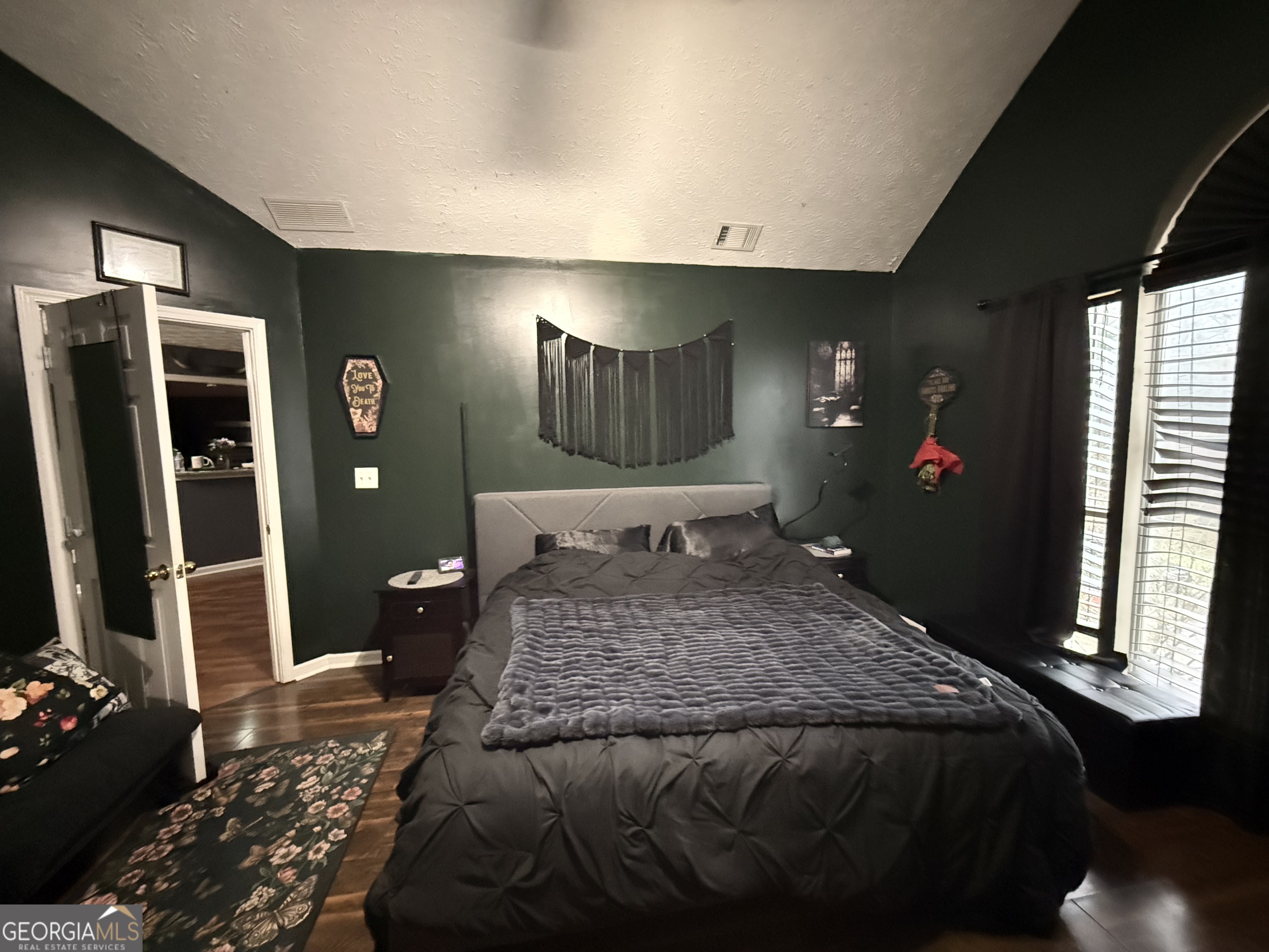 55 Jill Lane Covington, GA 30016 - Photo 13 of 52 a bedroom with a bed and a large mirror on the dresser