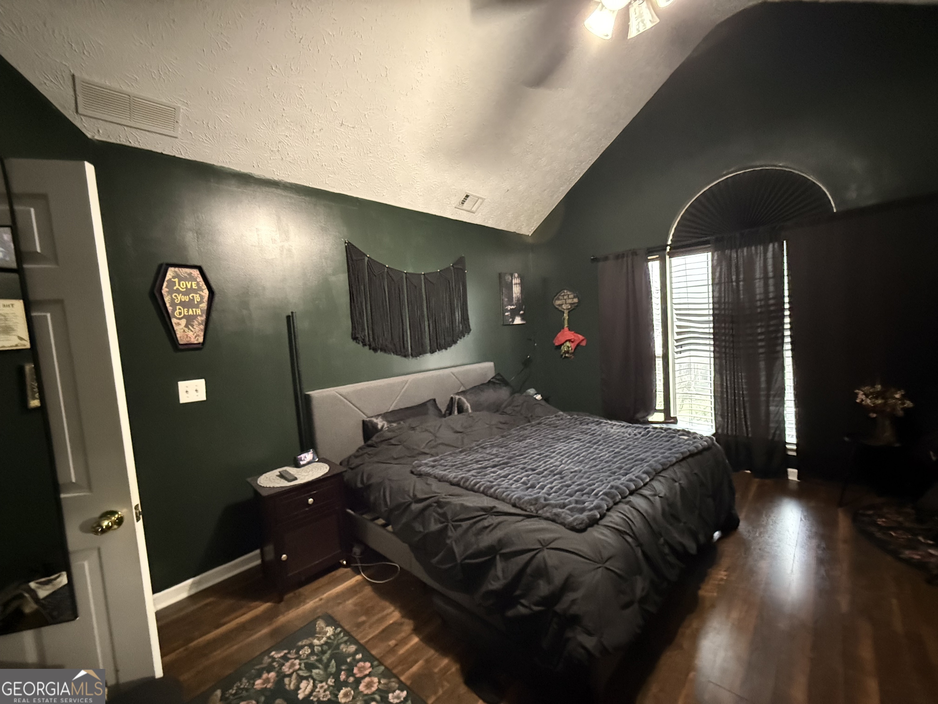 55 Jill Lane Covington, GA 30016 - Photo 14 of 52 a bedroom with a bed and a mirror on dresser