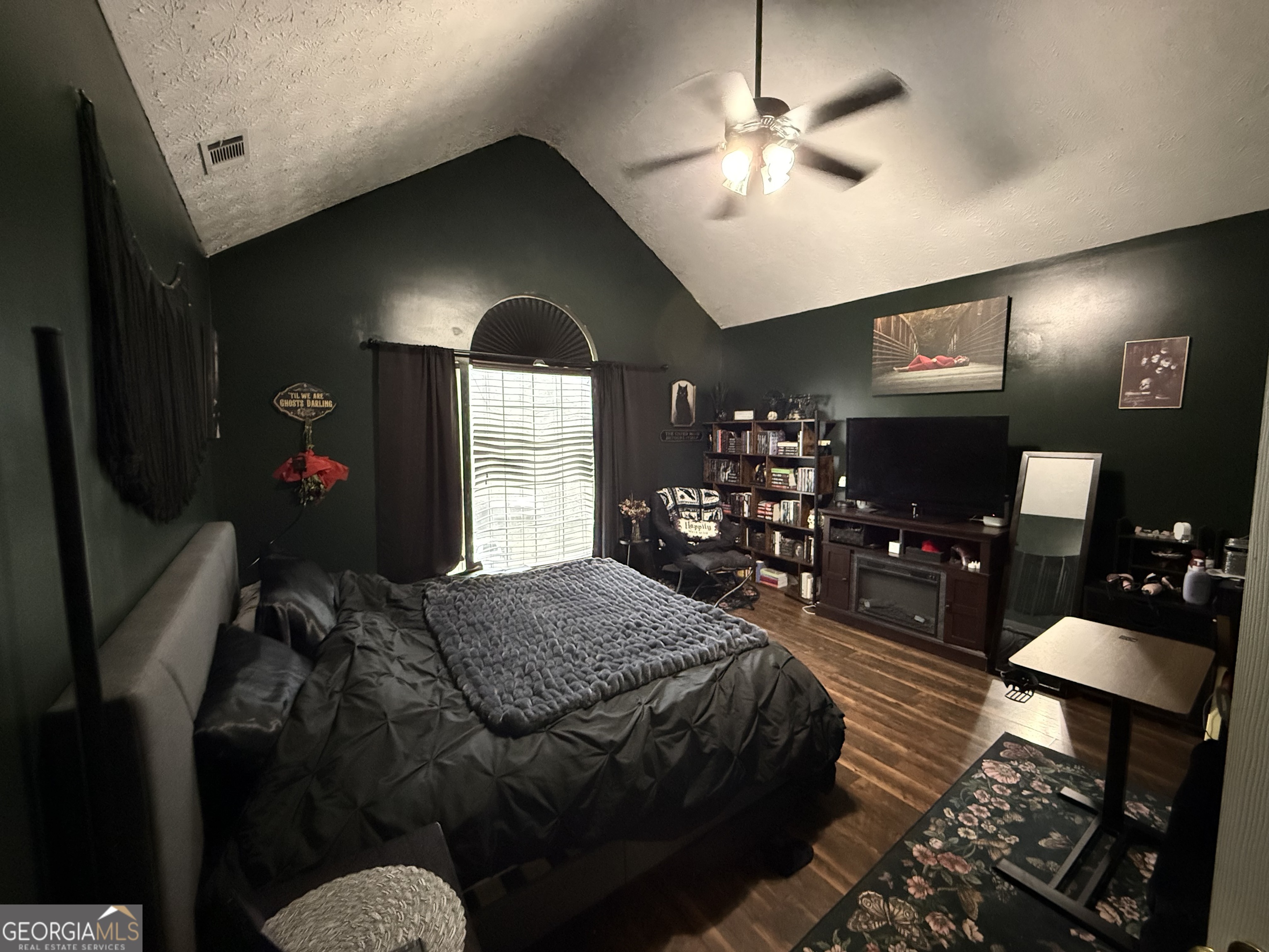 55 Jill Lane Covington, GA 30016 - Photo 15 of 52 a bedroom with bed or couch and a chandelier