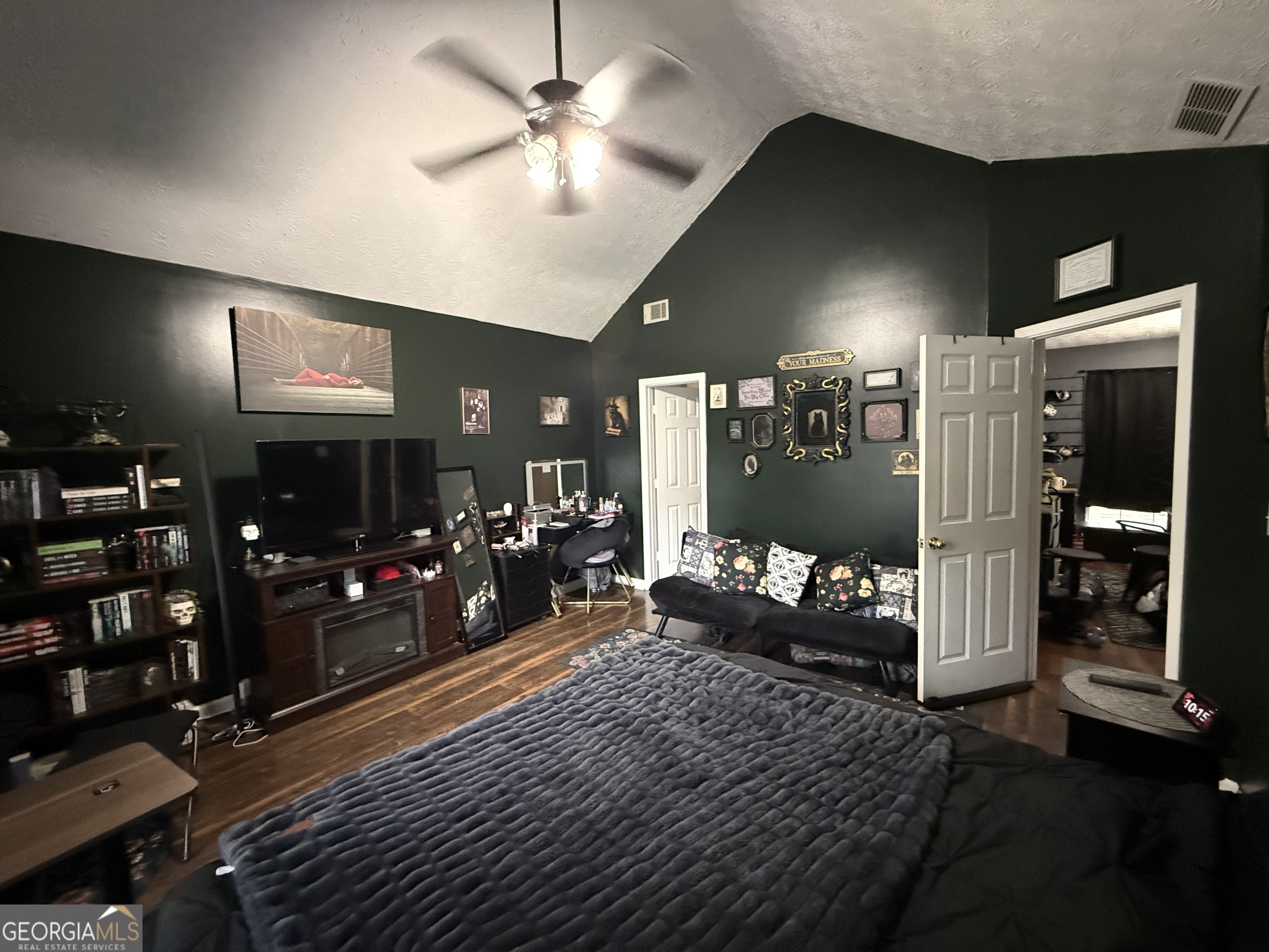 55 Jill Lane Covington, GA 30016 - Photo 16 of 52 a living room with furniture and a flat screen tv