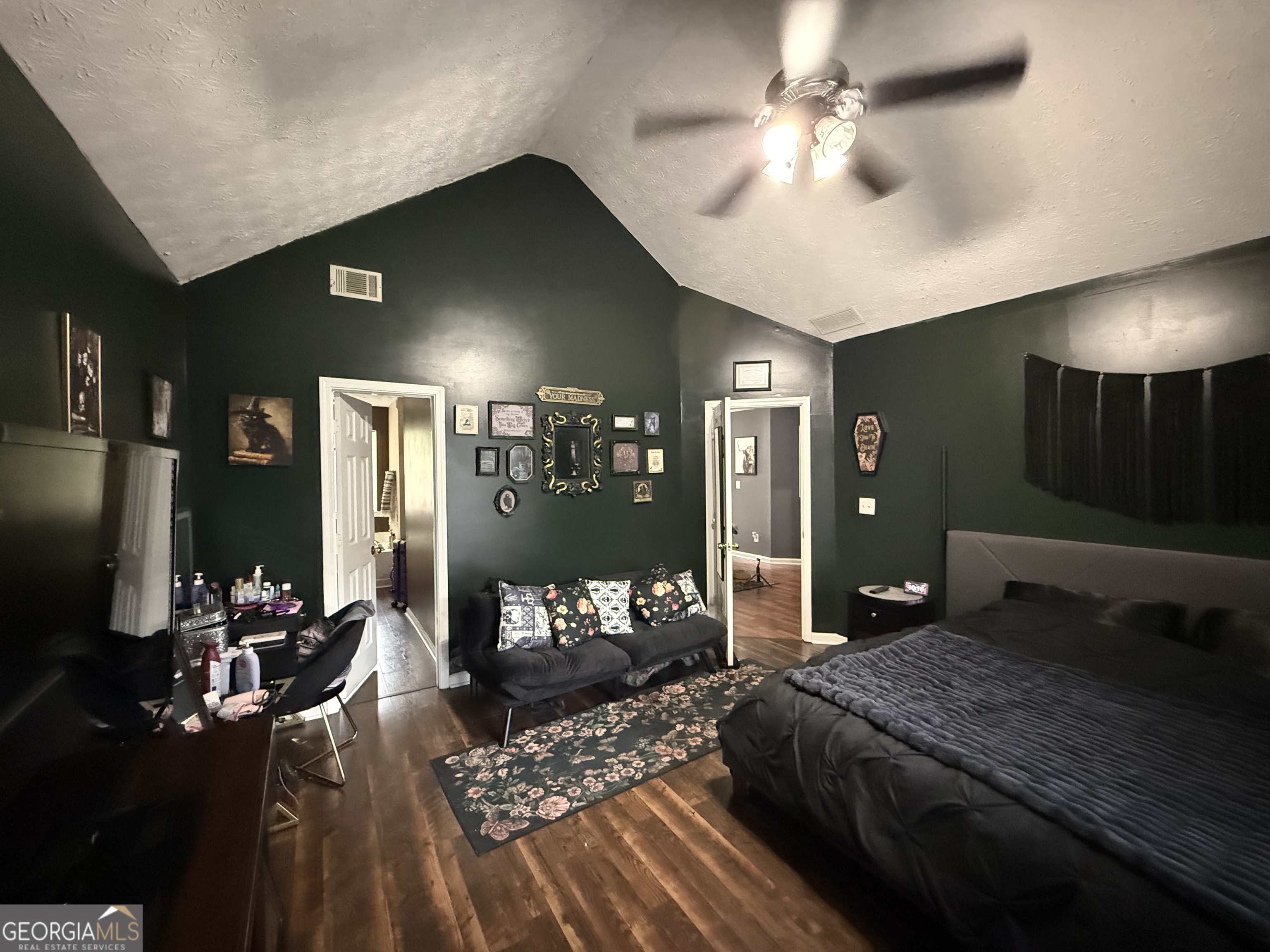 55 Jill Lane Covington, GA 30016 - Photo 17 of 52 a bedroom with a bed chandelier and a window