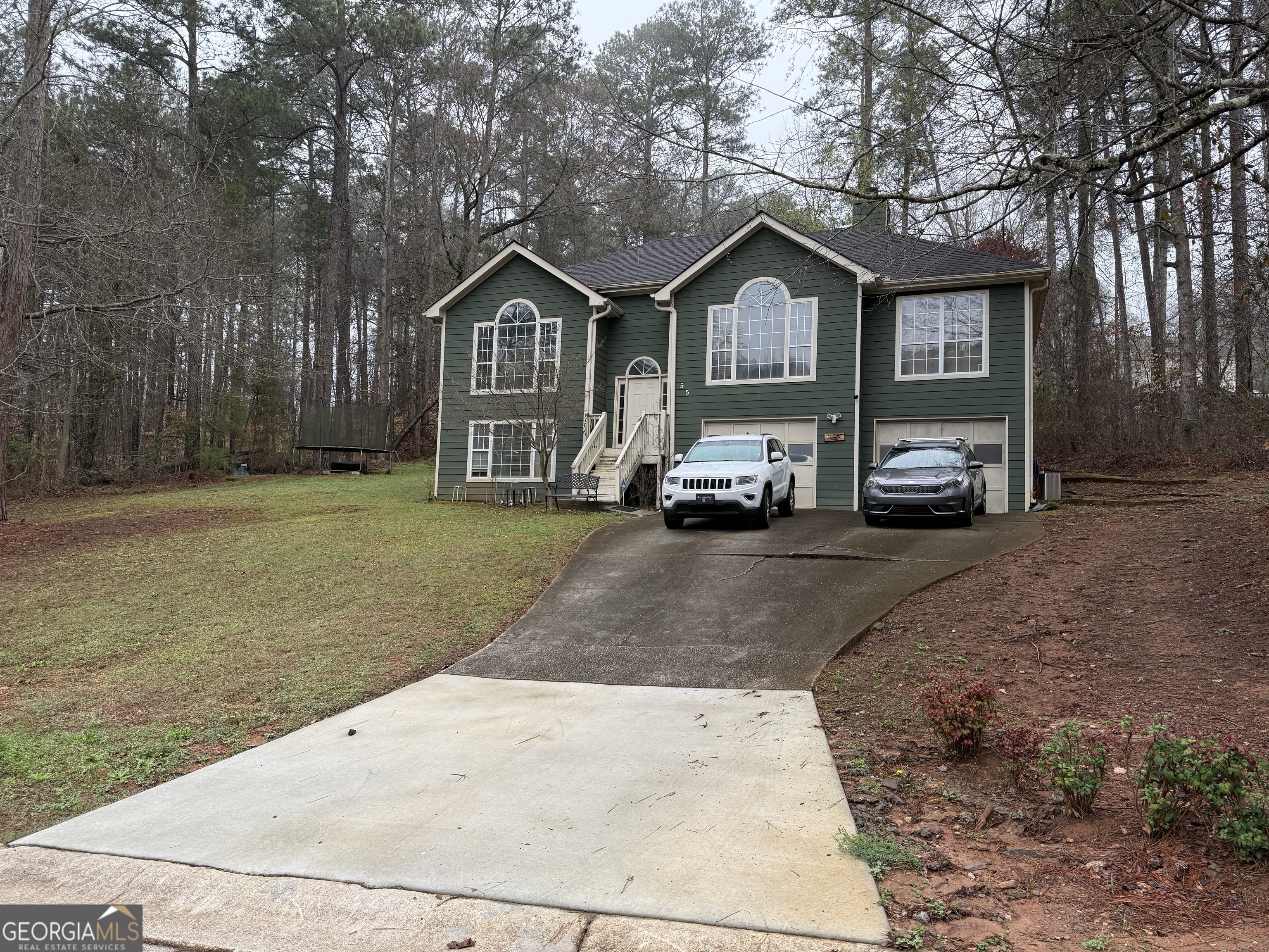 55 Jill Lane Covington, GA 30016 - Photo 24 of 52 a car parked in front of a house