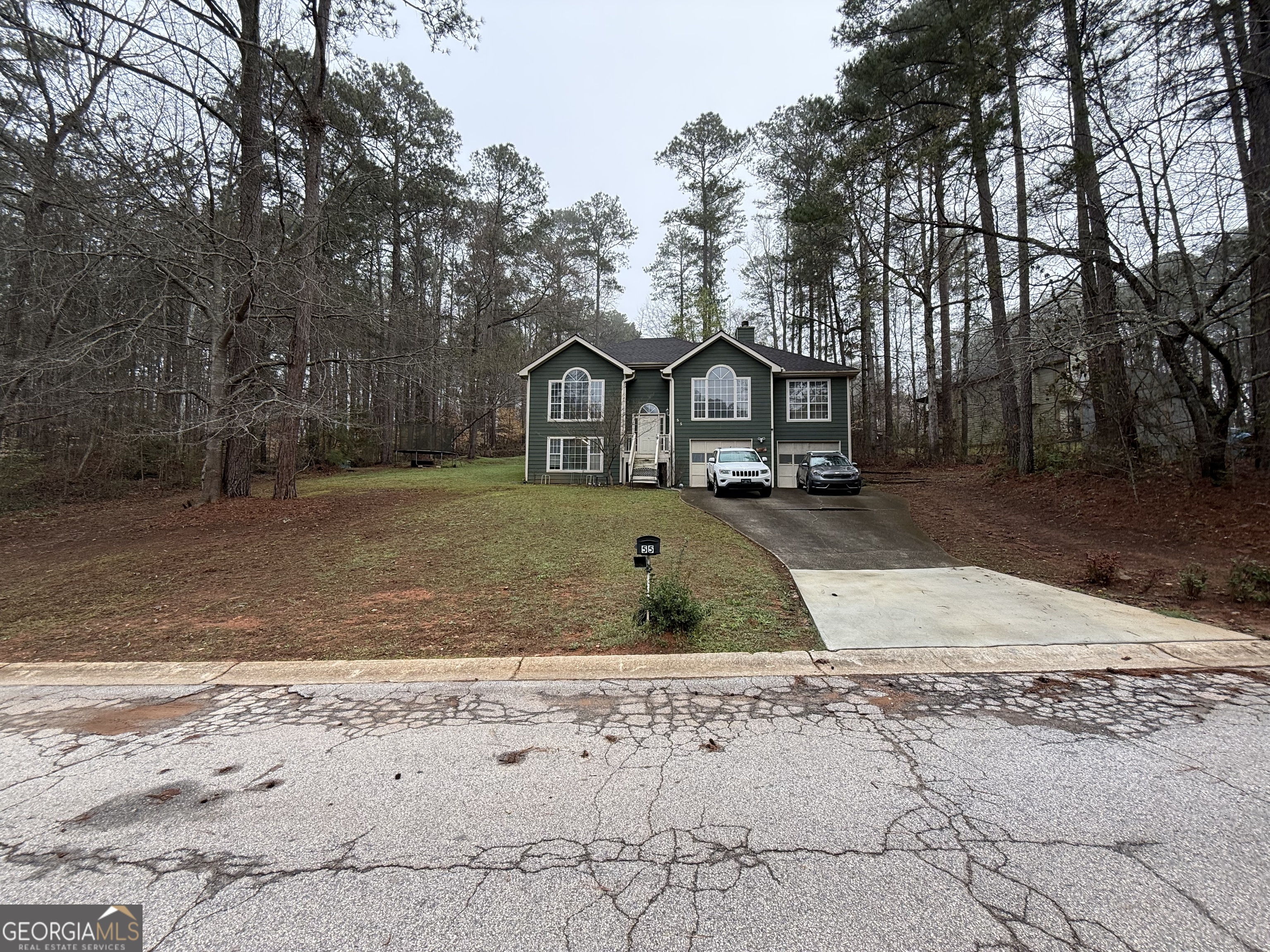 55 Jill Lane Covington, GA 30016 - Photo 26 of 52 a front view of a house with a yard