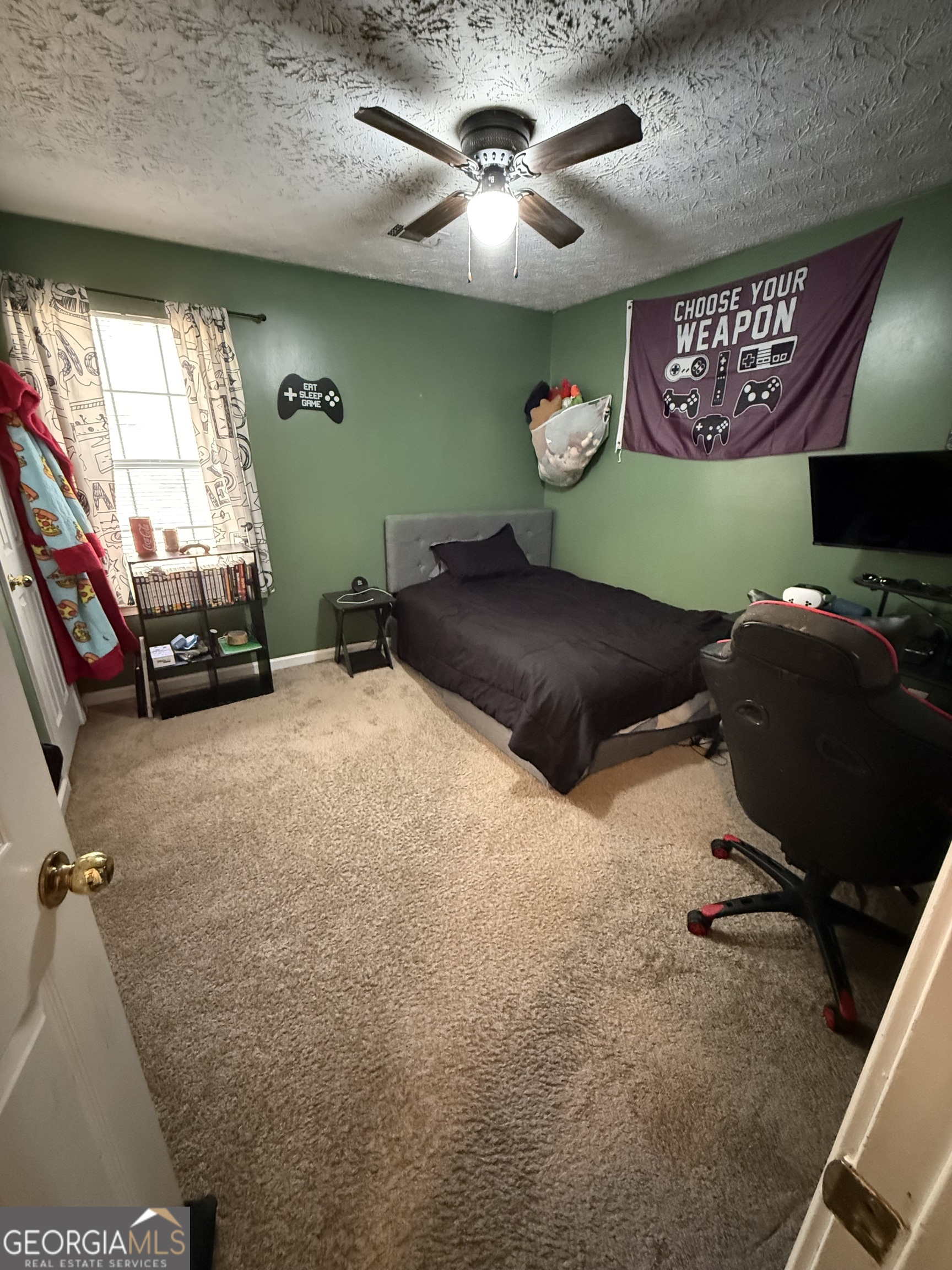 55 Jill Lane Covington, GA 30016 - Photo 30 of 52 a room with furniture and a flat screen tv