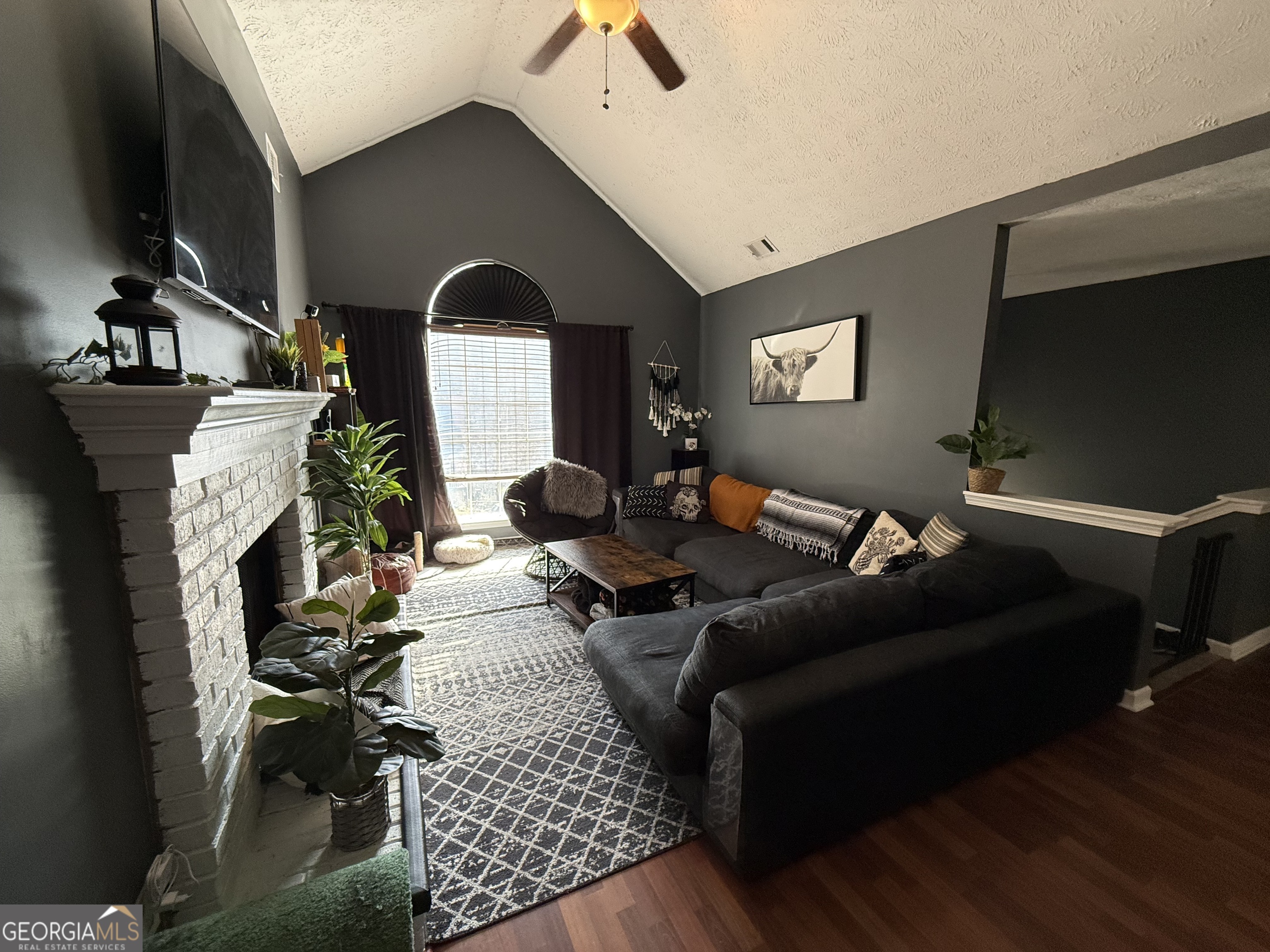 55 Jill Lane Covington, GA 30016 - Photo 3 of 52 a living room with furniture and a flat screen tv