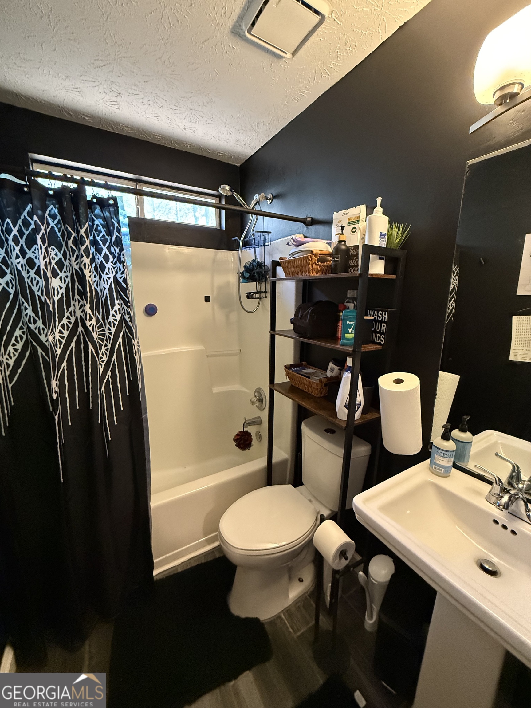 55 Jill Lane Covington, GA 30016 - Photo 34 of 52 a bathroom with a sink toilet and shower