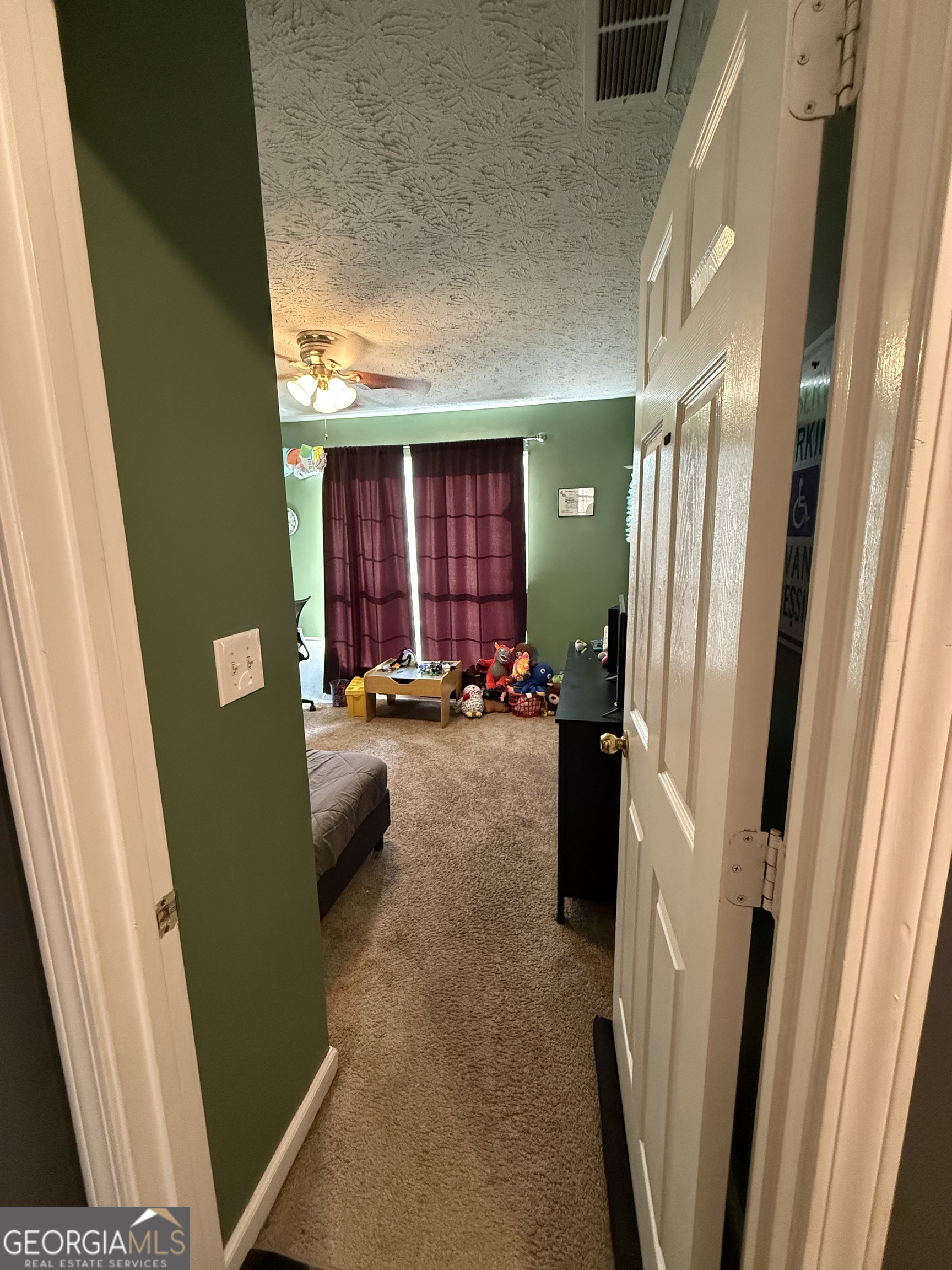 55 Jill Lane Covington, GA 30016 - Photo 36 of 52 a view of hallway with furniture and a large window