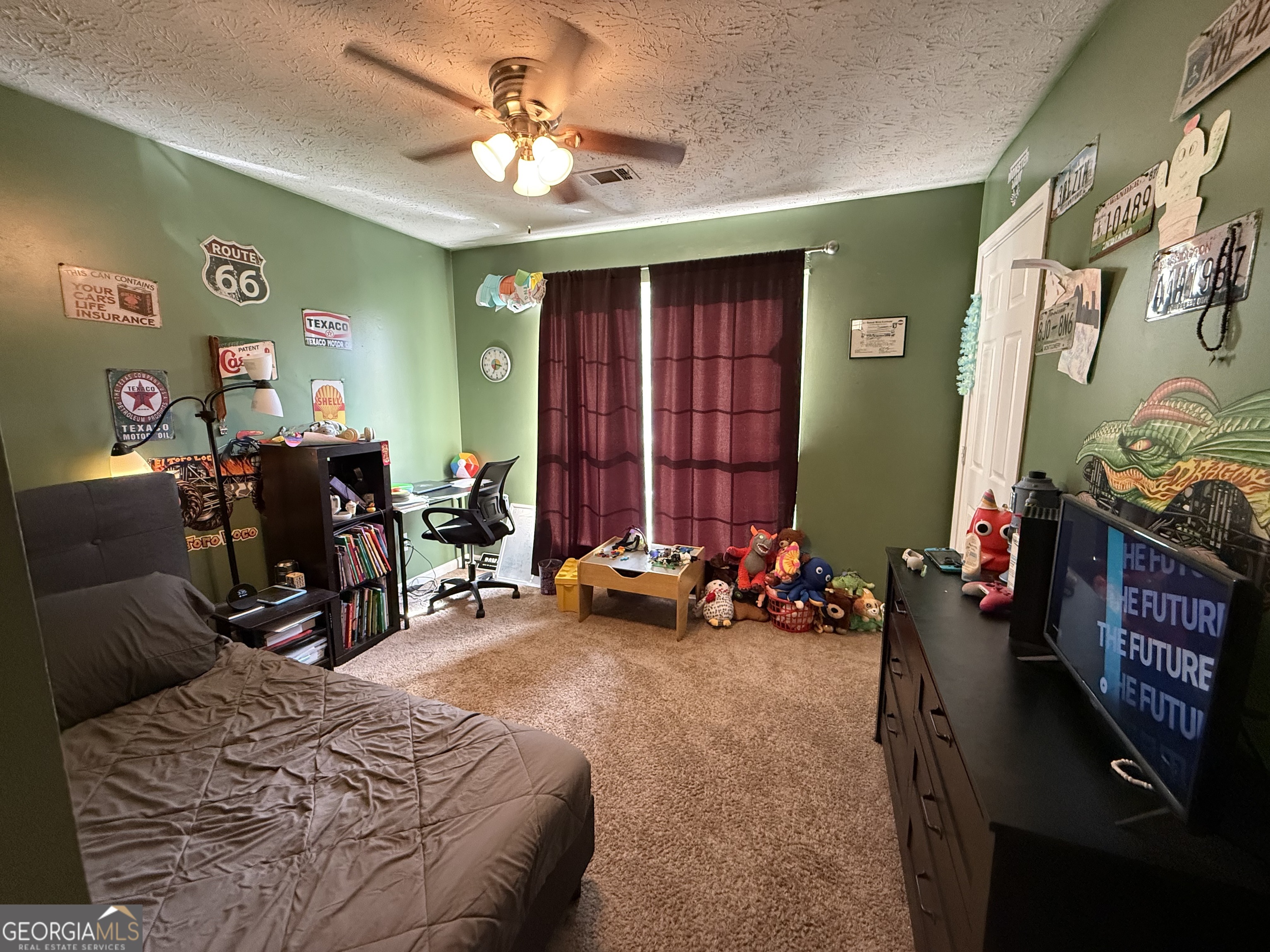 55 Jill Lane Covington, GA 30016 - Photo 37 of 52 a bedroom with furniture and a ceiling fan
