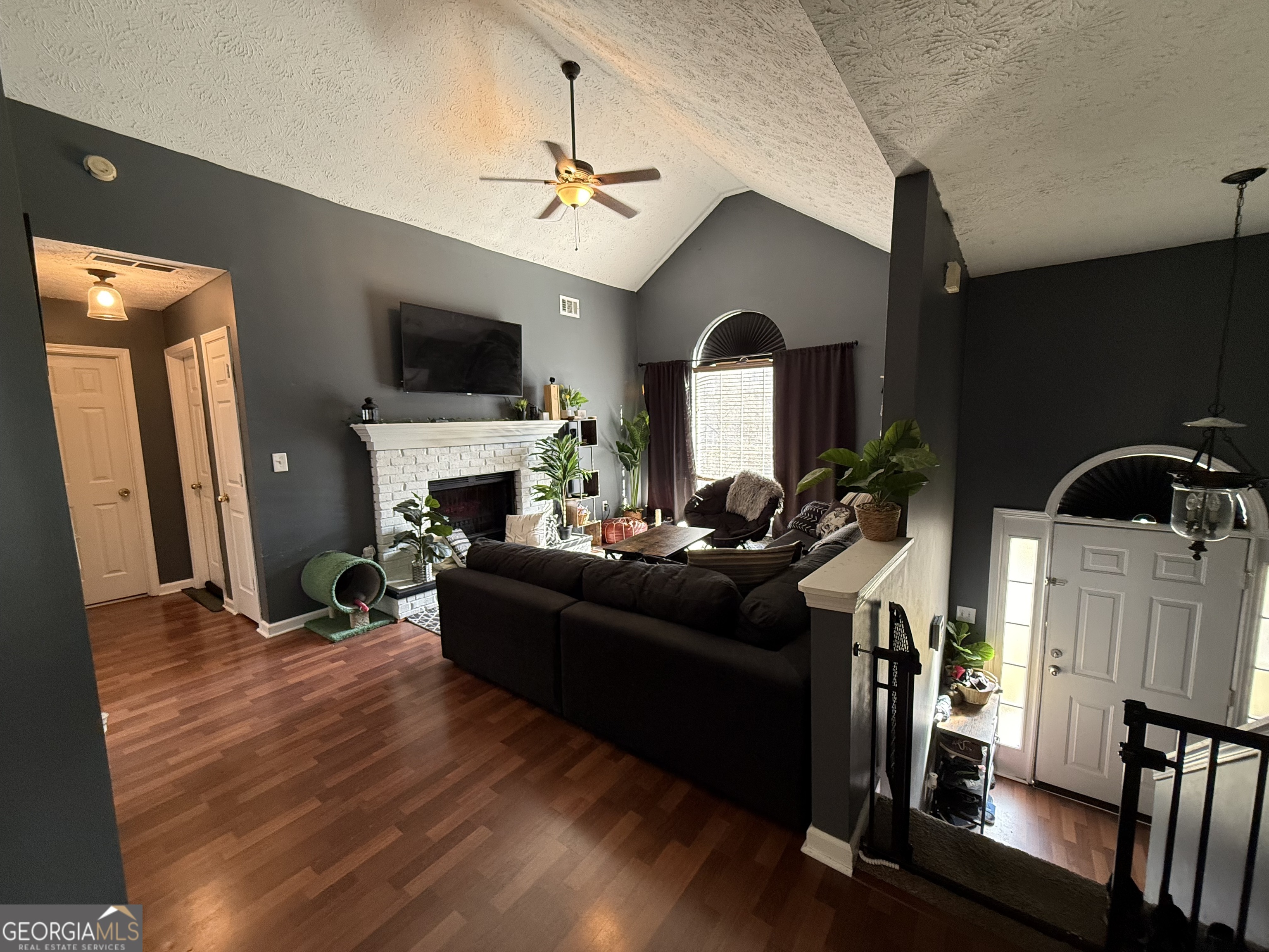 55 Jill Lane Covington, GA 30016 - Photo 40 of 52 a living room with furniture and a fireplace