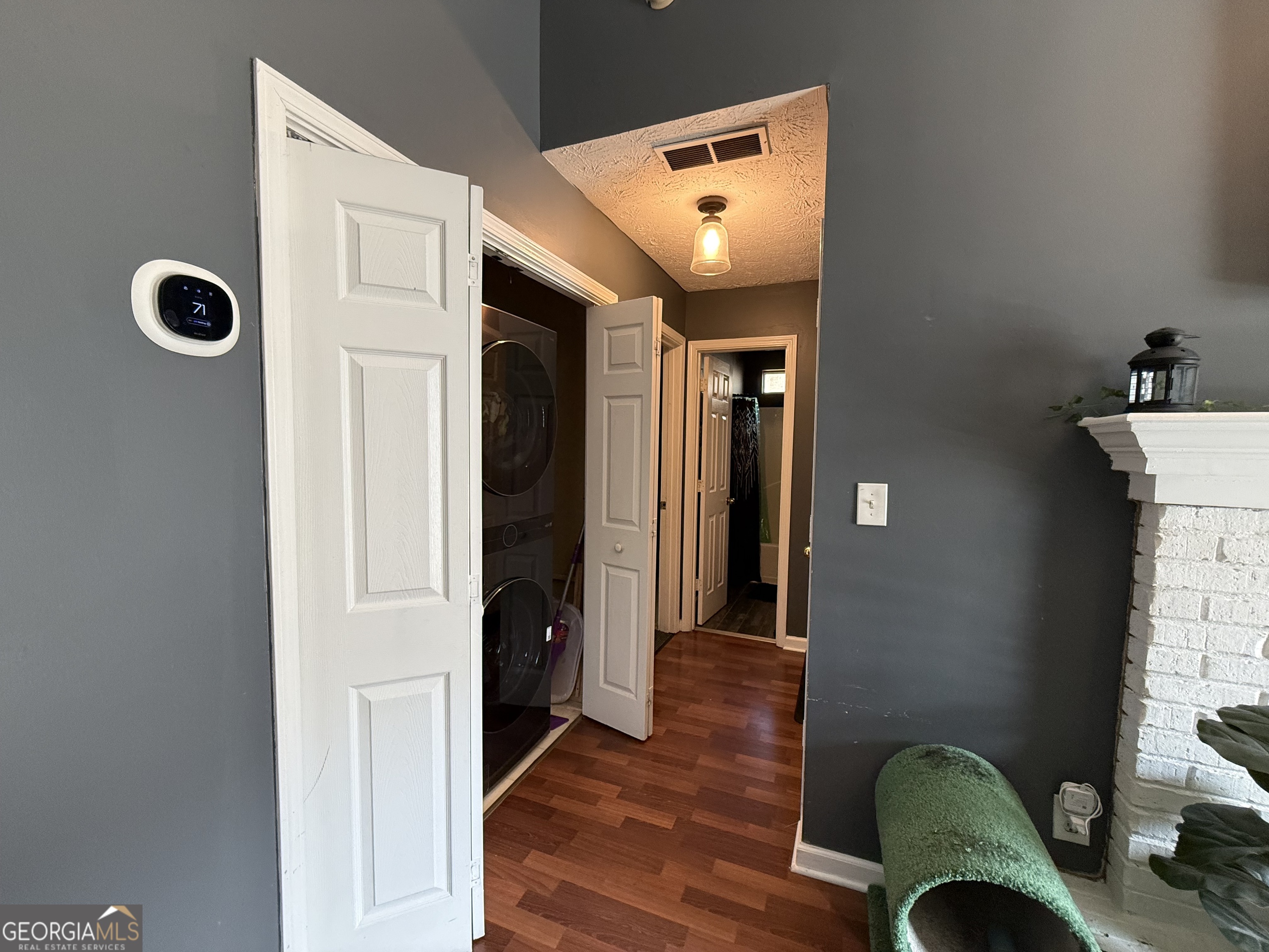 55 Jill Lane Covington, GA 30016 - Photo 41 of 52 a view of entryway and hall with wooden floor
