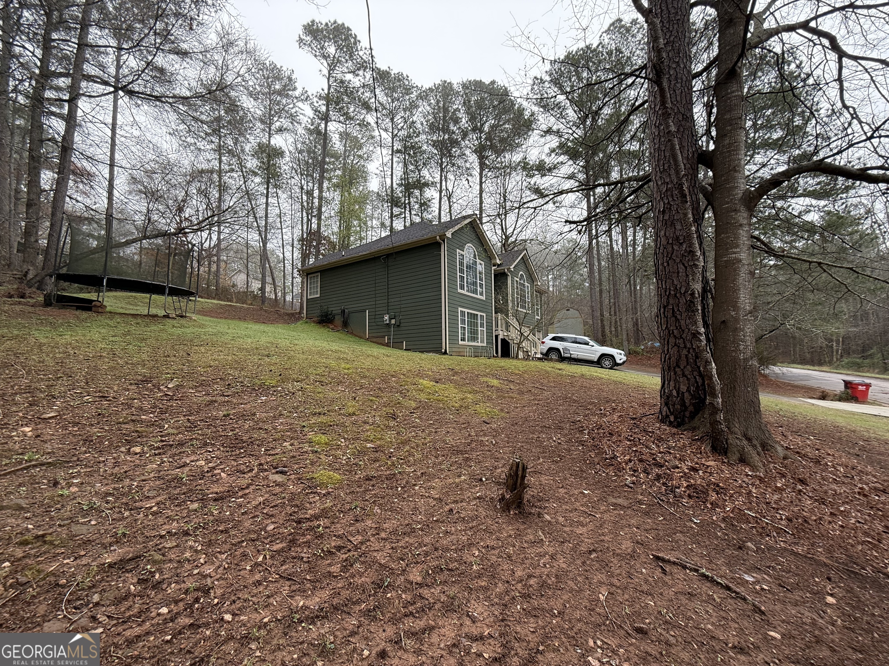 55 Jill Lane Covington, GA 30016 - Photo 49 of 52 a view of a house with a yard