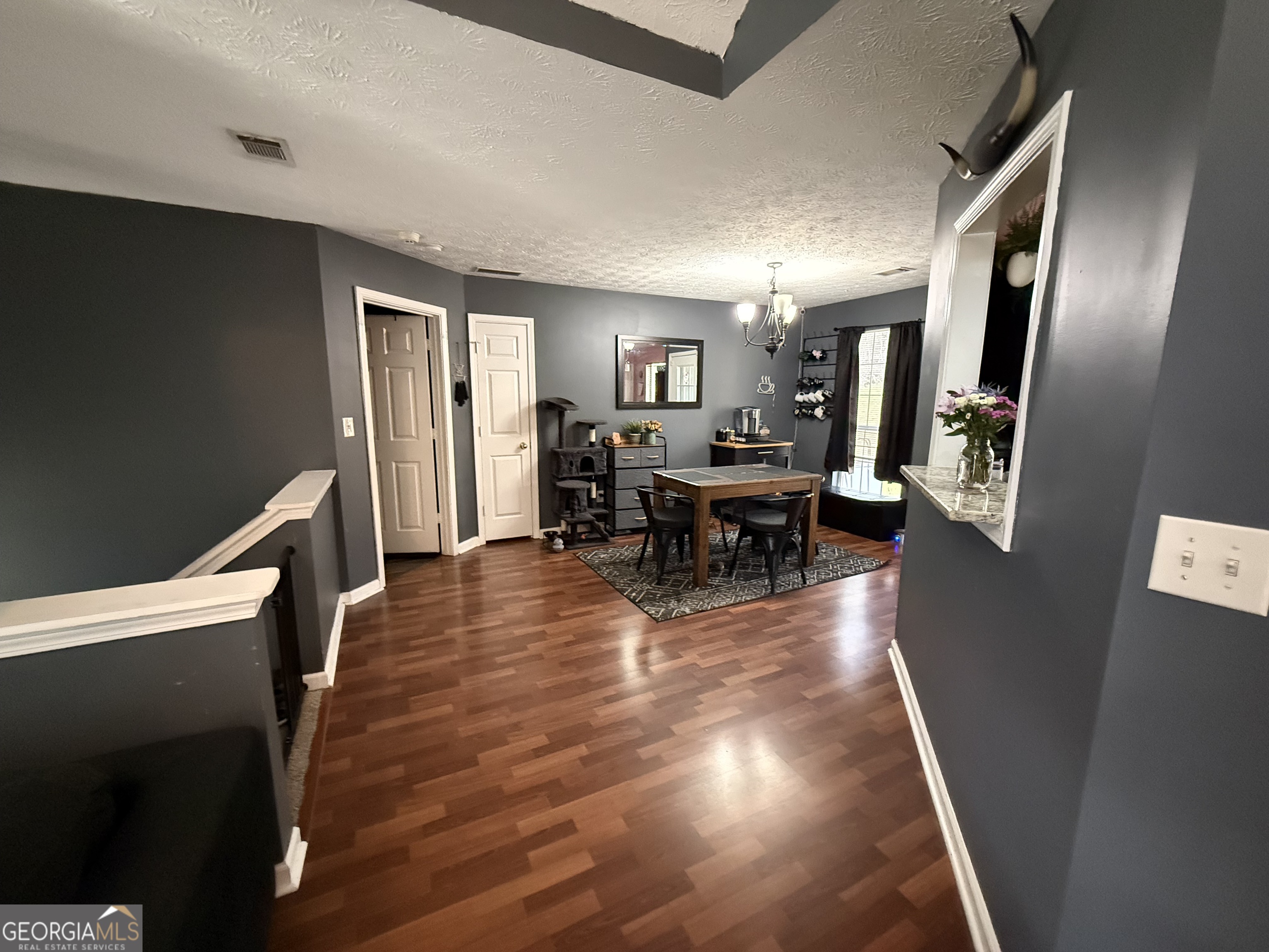 55 Jill Lane Covington, GA 30016 - Photo 5 of 52 a view of a livingroom with furniture window and wooden floor
