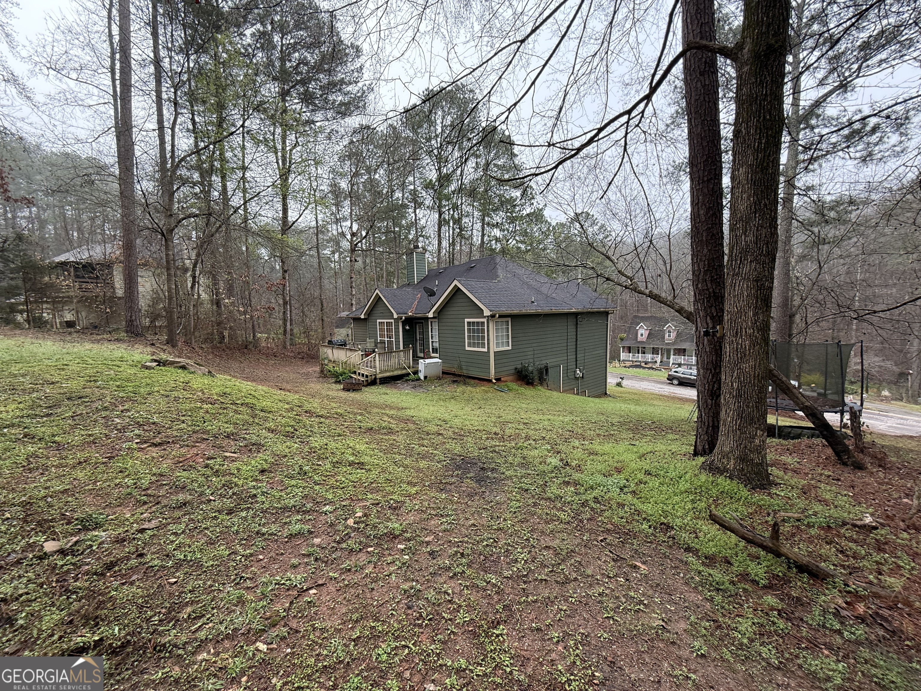 55 Jill Lane Covington, GA 30016 - Photo 51 of 52 a front view of a house with garden