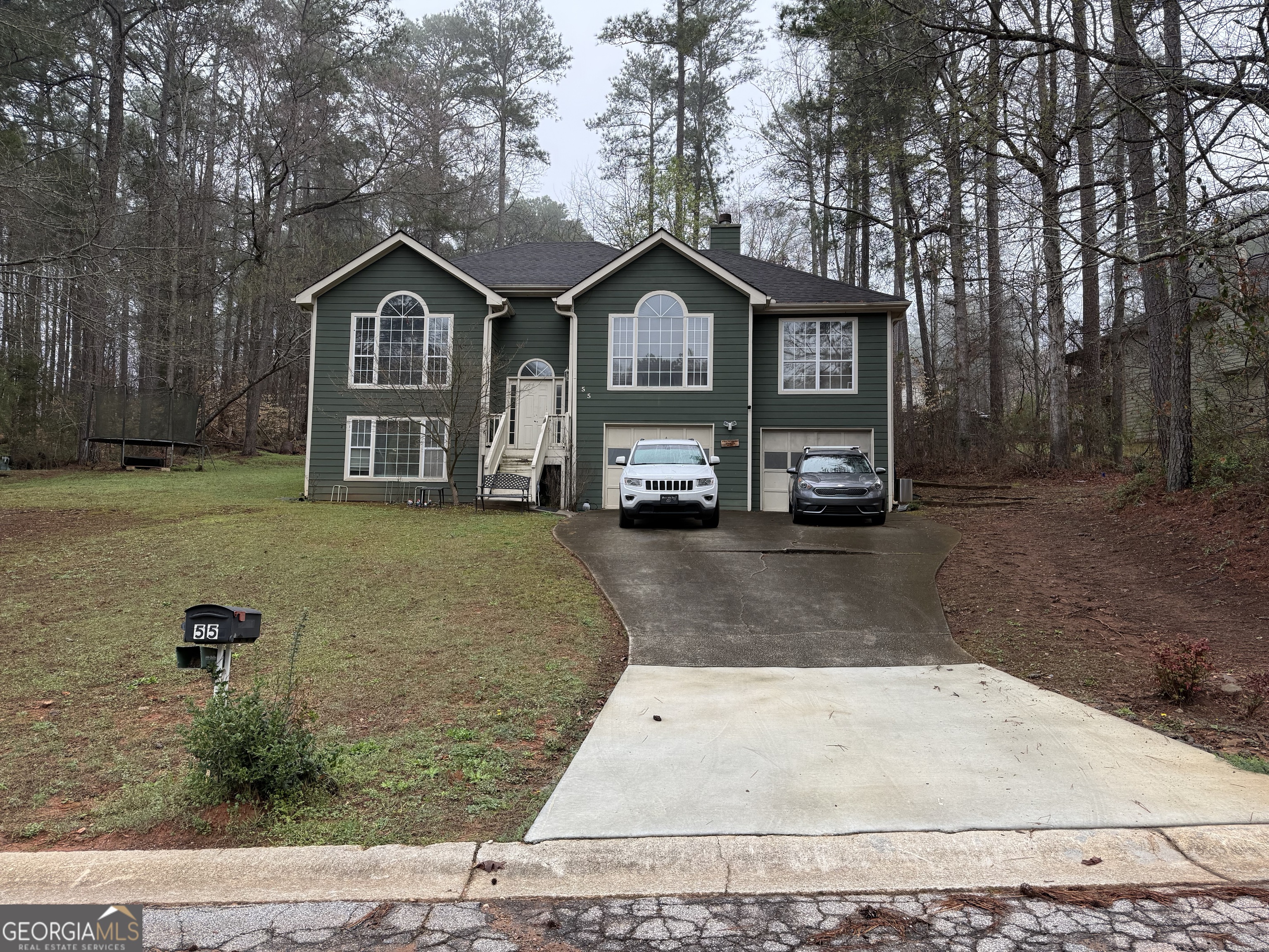 55 Jill Lane Covington, GA 30016 - Photo 52 of 52 a front view of a house with a yard