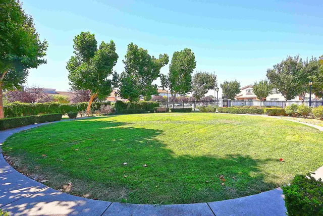 a view of a swimming pool with a yard