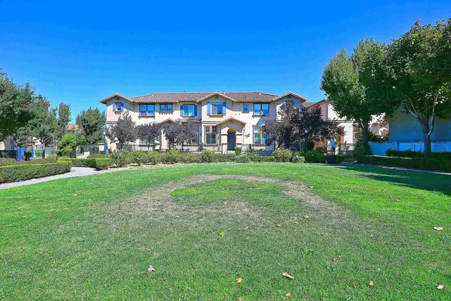 a view of a building with a yard