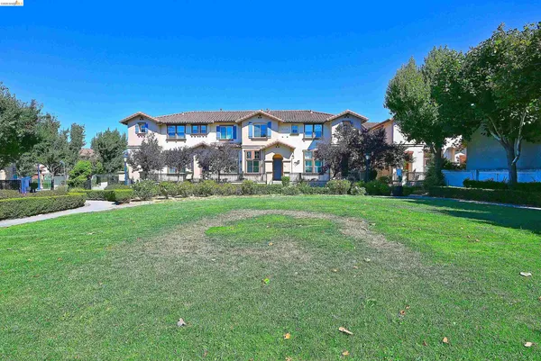 a view of a building with a yard