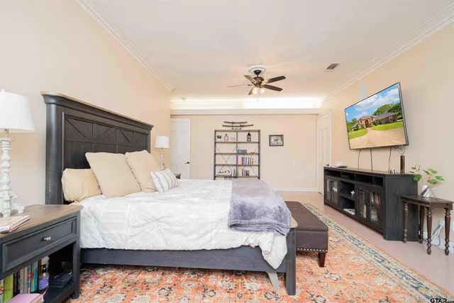 a bed room with a bed and a television