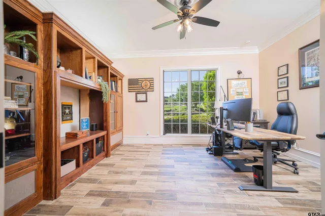 a view of a livingroom with furniture window and wooden floor