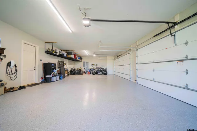 a view of a chairs and table in the garden
