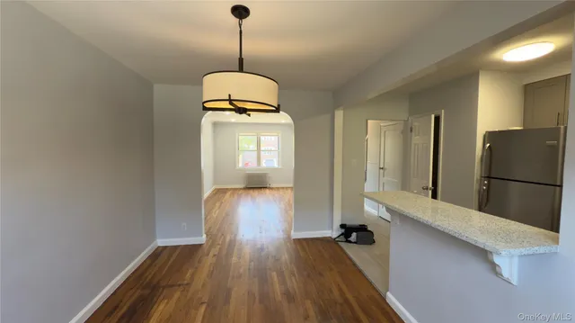 a view of hallway with wooden floor