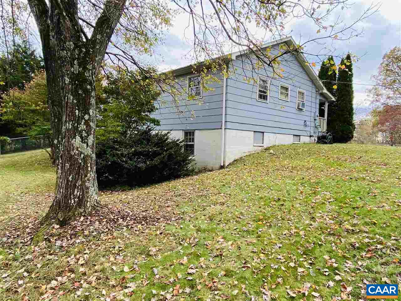 38 George James Loop Radiant, VA 22732 - Photo 2 of 24 a yellow house with trees in front of it