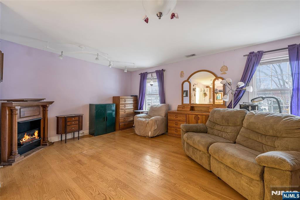 255 Knoll Road Lake Hiawatha, NJ 07034 - Photo 24 of 35 a living room with furniture and a fireplace