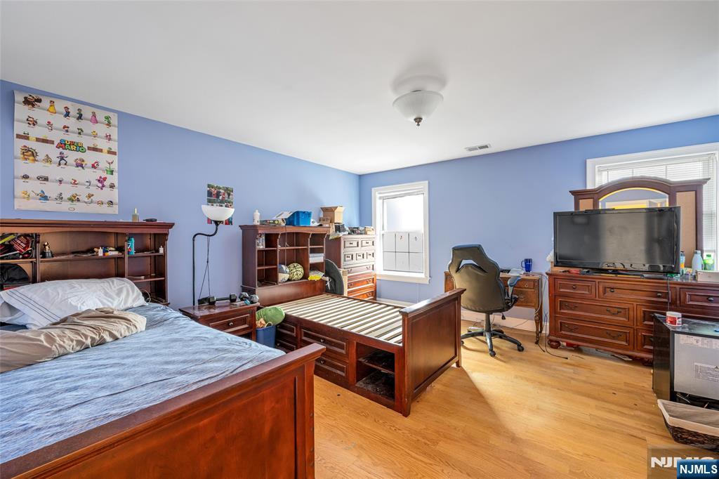 255 Knoll Road Lake Hiawatha, NJ 07034 - Photo 28 of 35 a bedroom with furniture and a flat screen tv