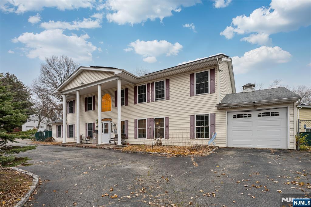 255 Knoll Road Lake Hiawatha, NJ 07034 - Photo 3 of 35 a front view of a house with a yard