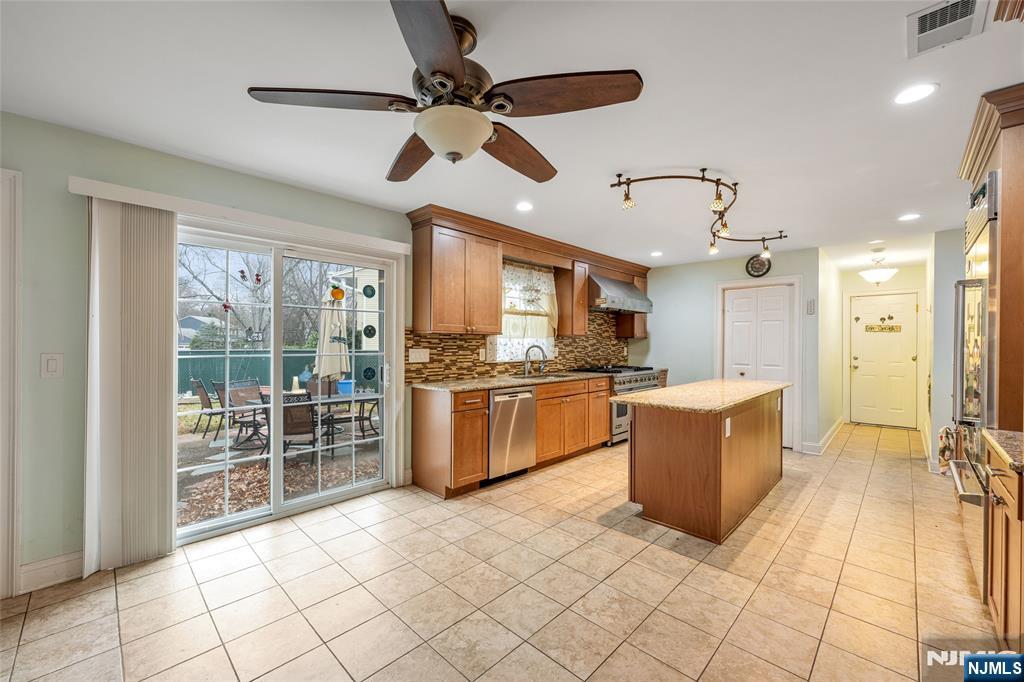 255 Knoll Road Lake Hiawatha, NJ 07034 - Photo 8 of 35 a large kitchen with cabinets and stainless steel appliances