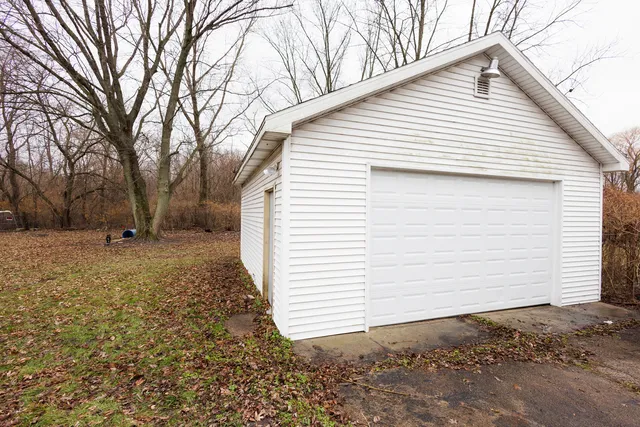 a view of a backyard with a large tree