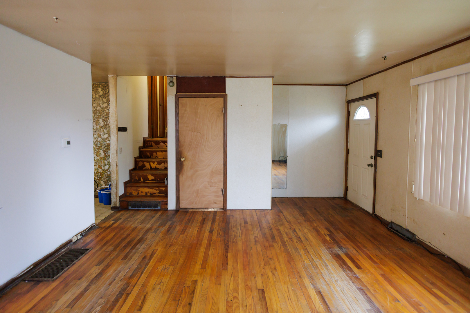 12878 East 2310S Road Pembroke Township, IL 60958 - Photo 19 of 44 a view of an empty room with wooden floor and a window
