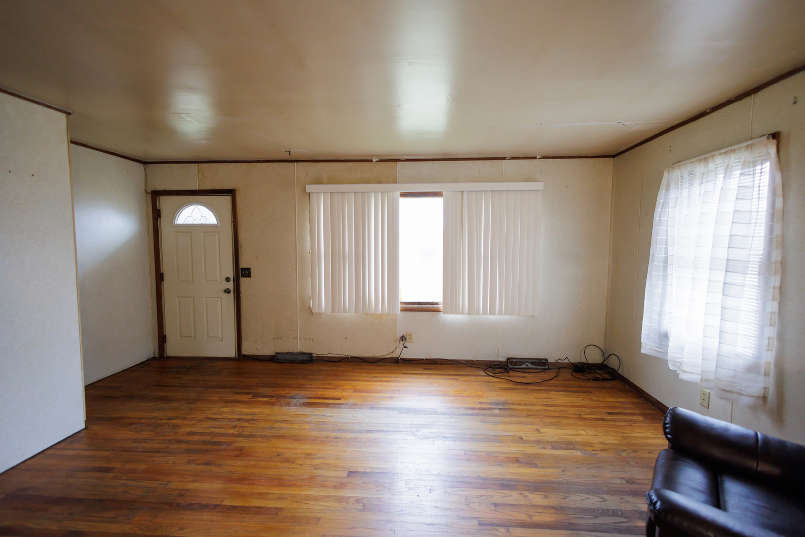12878 East 2310S Road Pembroke Township, IL 60958 - Photo 20 of 44 an empty room with wooden floor and windows