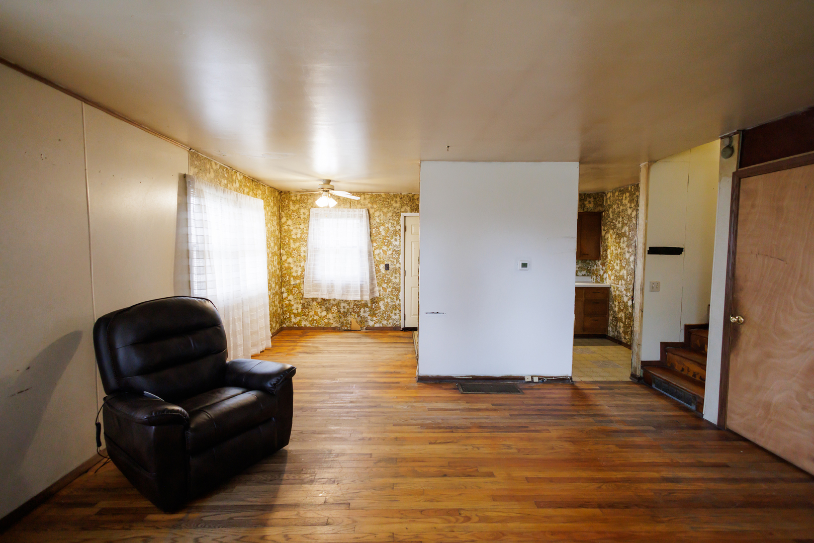 12878 East 2310S Road Pembroke Township, IL 60958 - Photo 22 of 44 a living room with furniture and wooden floor