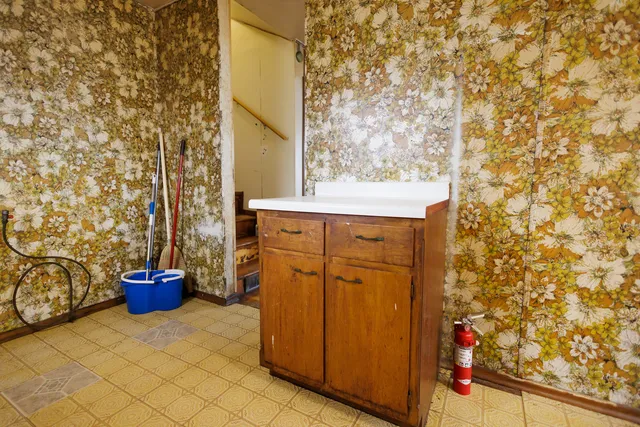 a bathroom with a sink and a potted plant