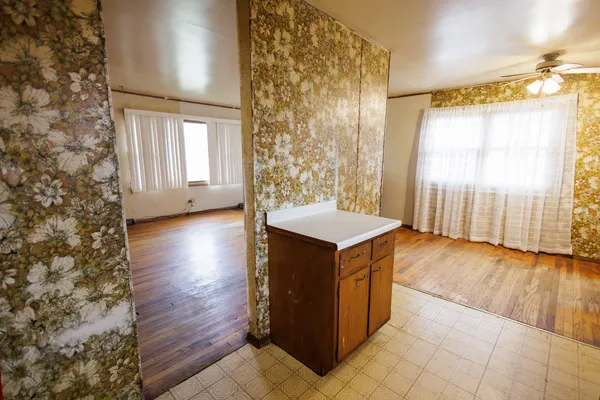 a kitchen with a wooden cabinets and a stove