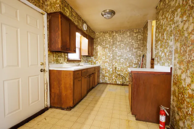 a bathroom with a sink a mirror and a shower