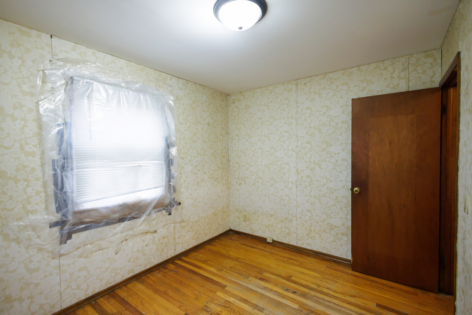 12878 East 2310S Road Pembroke Township, IL 60958 - Photo 33 of 44 a view of an empty room with wooden floor and a window