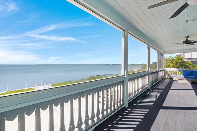a view of balcony with wooden floor