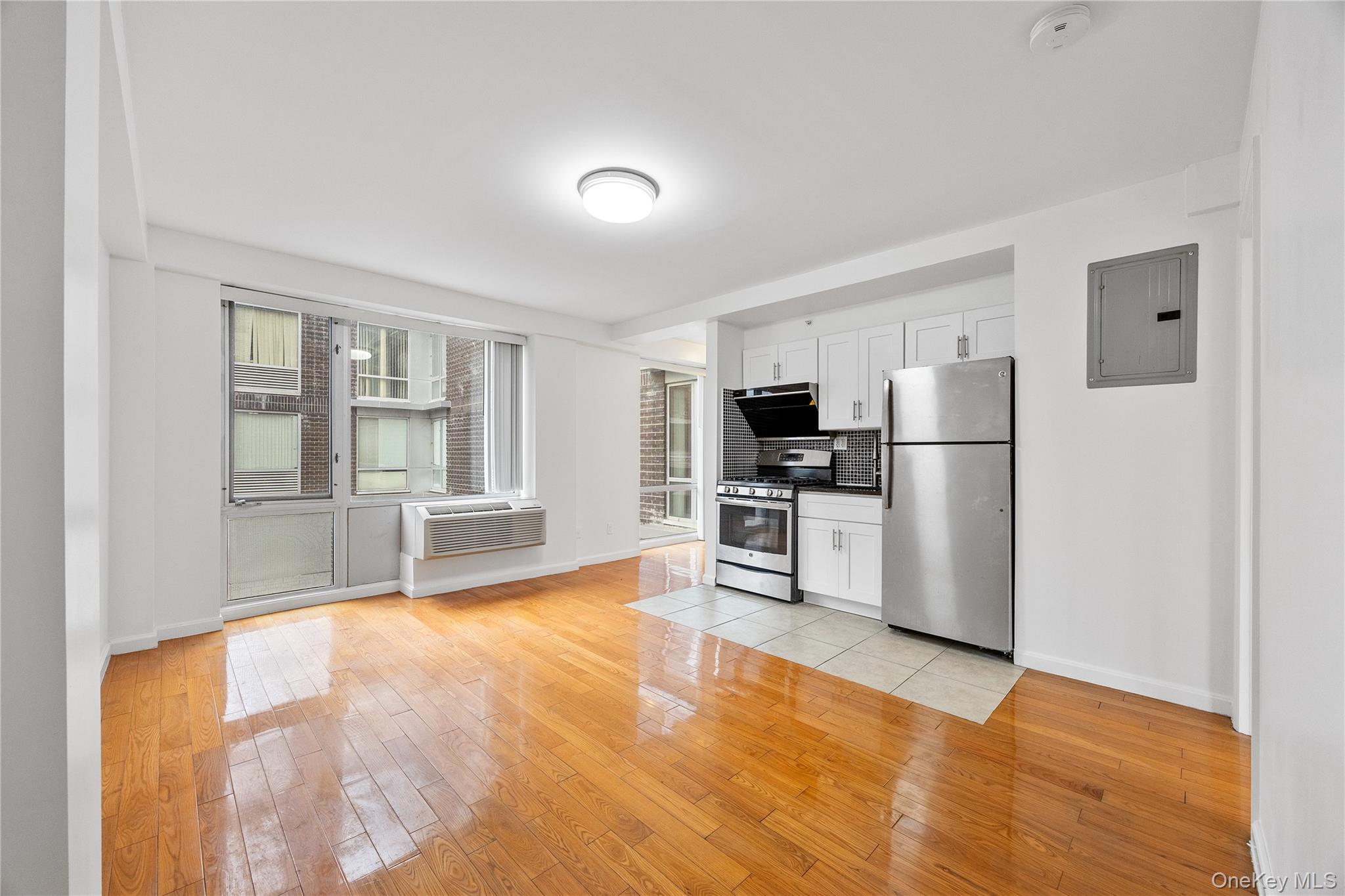 139-30 34th Avenue, Unit 3B Queens, NY 11354 - Photo 11 of 20 a view of kitchen with stainless steel appliances refrigerator oven and stove