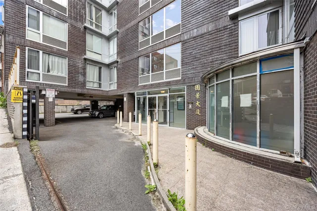 a view of a building with a glass door