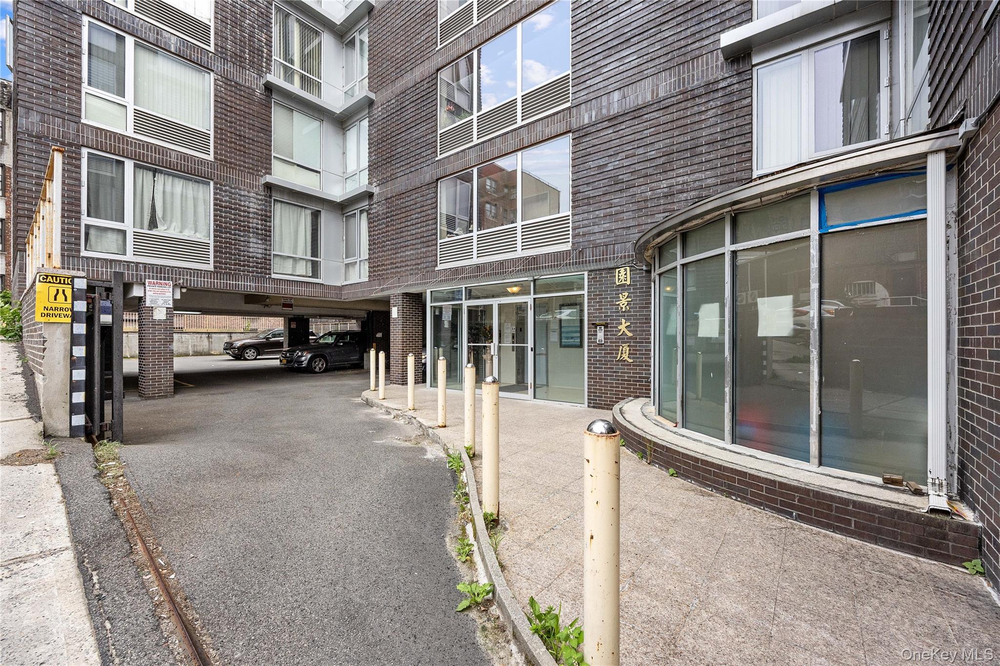 139-30 34th Avenue, Unit 3B Queens, NY 11354 - Photo 18 of 20 a view of a building with a glass door