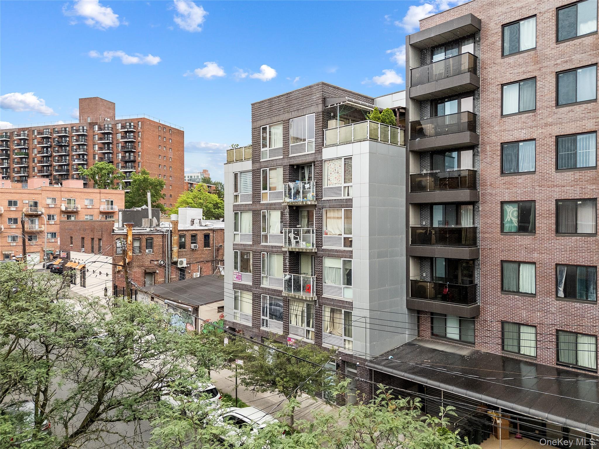 139-30 34th Avenue, Unit 3B Queens, NY 11354 - Photo 19 of 20 a city view with tall buildings