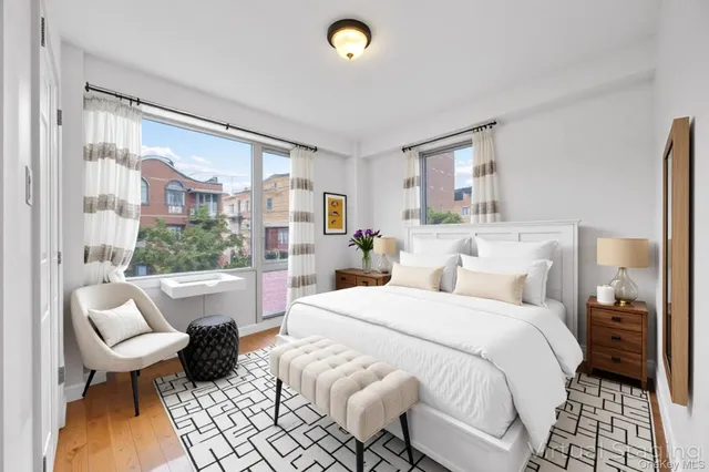 a bed room with a bed and a chair