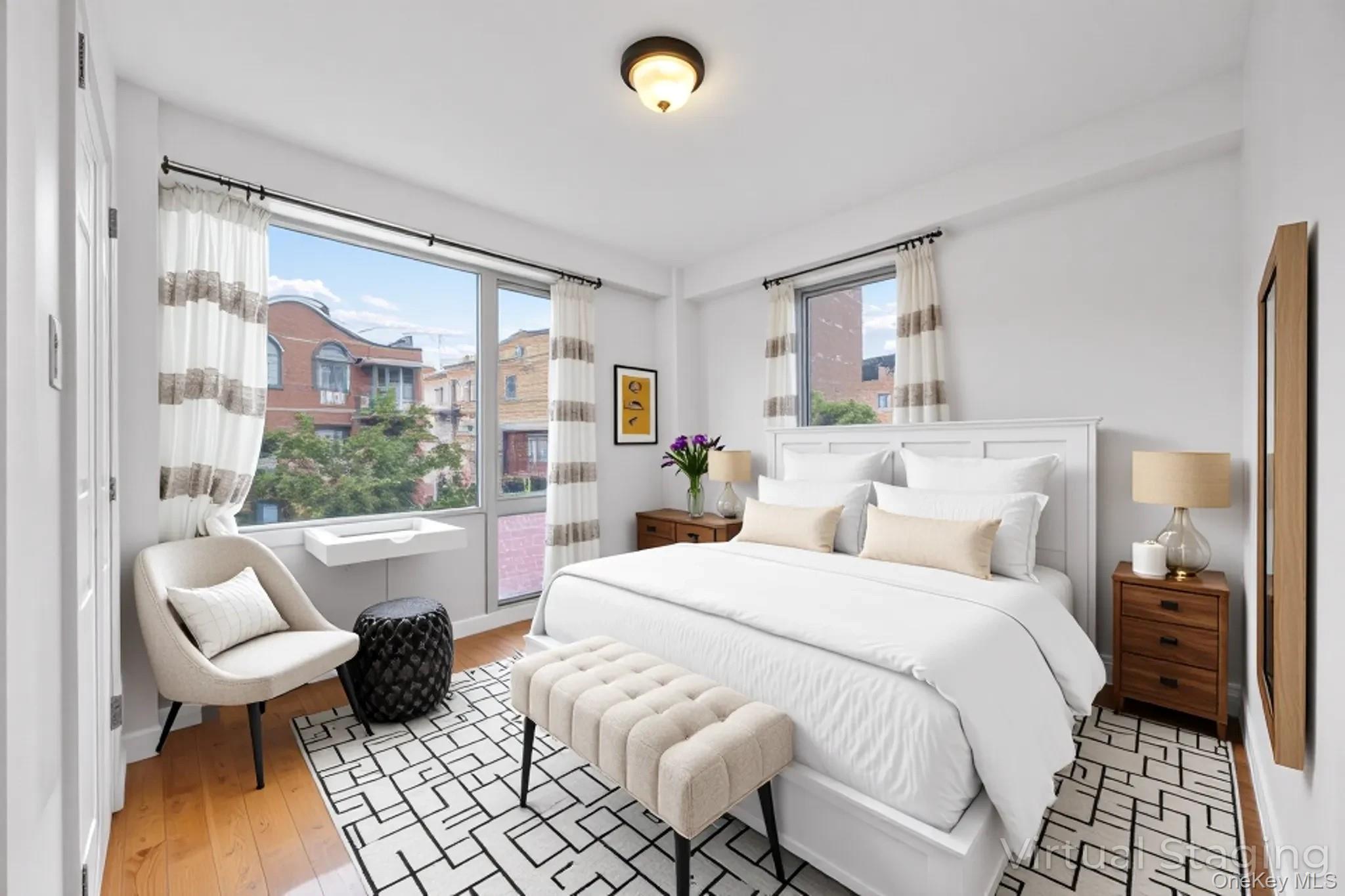 139-30 34th Avenue, Unit 3B Queens, NY 11354 - Photo 3 of 20 a bed room with a bed and a chair