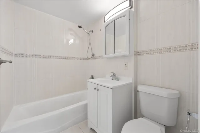 a bathroom with a sink a toilet and bathtub