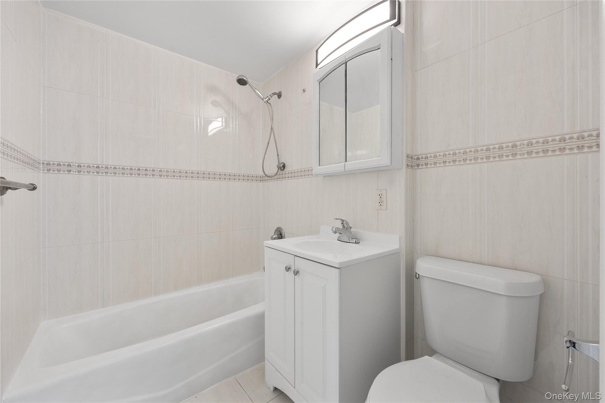 139-30 34th Avenue, Unit 3B Queens, NY 11354 - Photo 8 of 20 a bathroom with a sink a toilet and bathtub